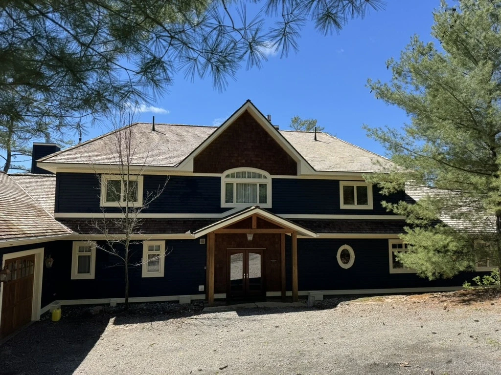 Professional roof cleaning in progress in Ontario